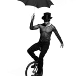 Albert Watson, Man on Unicycle with Umbrella, New York City, 1994