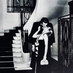 Helmut Newton, Woman in Coat Adjusting Stocking, Paris 1975, 1978