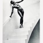Helmut Newton, Woman in Coat Adjusting Stocking, Paris 1975, 1978