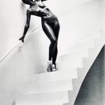 Helmut Newton, Woman in Coat Adjusting Stocking, Paris 1975, 1978
