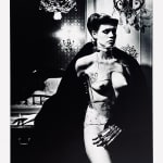 Helmut Newton, Woman in Coat Adjusting Stocking, Paris 1975, 1978