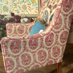Chair upholstered in Susan Deliss Padishah linen in red blue cream
