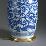A mid-eighteenth century porcelain vase of good scale, decorated with scrolling foliage in blue glazes, mounted as a lamp