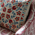 Chair upholstered in Susan Deliss Padishah linen in red blue cream
