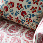 Chair upholstered in Susan Deliss Padishah linen in red blue cream