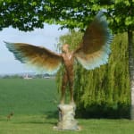 Bronze resin sculpture of mythical Greek winged figure Icarus by Nicola Godden, displayed on integral stone plinth