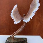 Figurative bronze sculpture of mythical Greek winged figure Icarus by Nicola Godden, displayed on plinth.