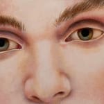 Painting of a face on a landscape background