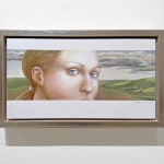Female head in front of a landscape
