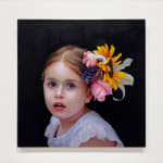 Portrait of a little girl with flowers in her hair