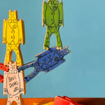 painting of wooden colorful toy block figurines