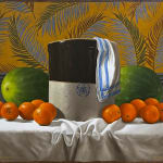 Large crock with watermelons and oranges around it before a floral wallpaper