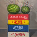 Painting of two watermelons with paintbrushes