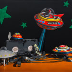 Painting of toy spaceships and VHS tape