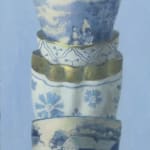 Stack of white and gold cups with ornate designs
