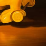 Painting of a toy dog with a hot dog