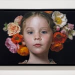Portrait of a young girl with flowers in her hair