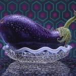 Still life of an eggplant in a glass bowl with a tiled background