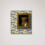 Painting depicting a framed image of a dog on blue floral wallpaper