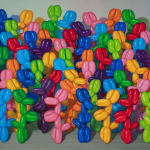 Multicolored balloon dogs gathered in a large group