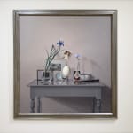 Still life with a table and an ostrich egg, photographs, and plants