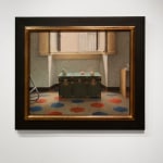 Image of a green trunk in a room filled with sunlight and a red, blue and white floor