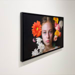 Painting of a girl with flowers in her hair
