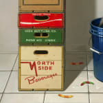 Detail of soda boxes and gummy worm bait on ground