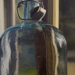 Painting of oversize glass bottle in front of a glass window pane