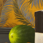 Detail of Large crock with watermelons and oranges around it before a floral wallpaper