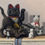 Cat and dog figurines atop stacked soda crates