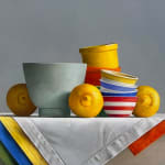 Lemons around light green bowl, stack of striped bowls, and small bowls