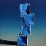 Stack of origami paper boxes on a blue background