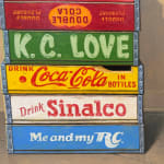 Still life painting with toys on soda boxes