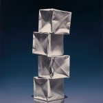 Offset column of 4 origami paper cubes with purple blue and black background