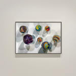 Photorealist painting of colorful marbles