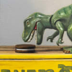 Painting of a toy dinosaur eating oreos