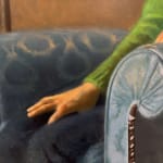 Painting of a woman sitting in an arm chair