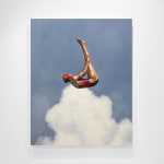 Woman in pink bathing suit soaring above the clouds