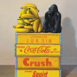 Still life painting of a gorilla with a pile of bananas on a stack of yellow crates