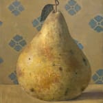 Pear sitting on table with blue design in background