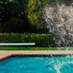 Splash from object submerging in pool above water
