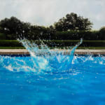 Big splash of water in a pool