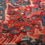 Painting of a woman sitting on carpet