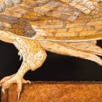 Painting of a brown owl on a ledge