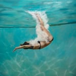 Oil painting of girl diving in water on canvas