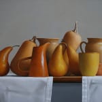 Orange and yellow fruits, vegetables, and cups on grey cloth