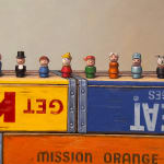 Painting of toy figurines on colorful crates