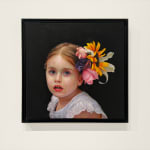 Portrait of a little girl with flowers in her hair