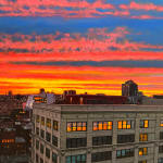 Colorful sunset over Manhattan buildings